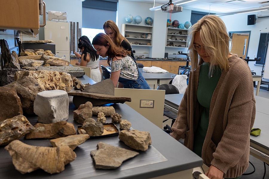 Students looking through geology samples.