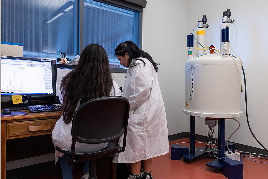 Students using a NMR spectrometer.